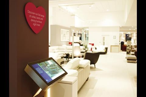 Screens delivering digital media content punctuate the store